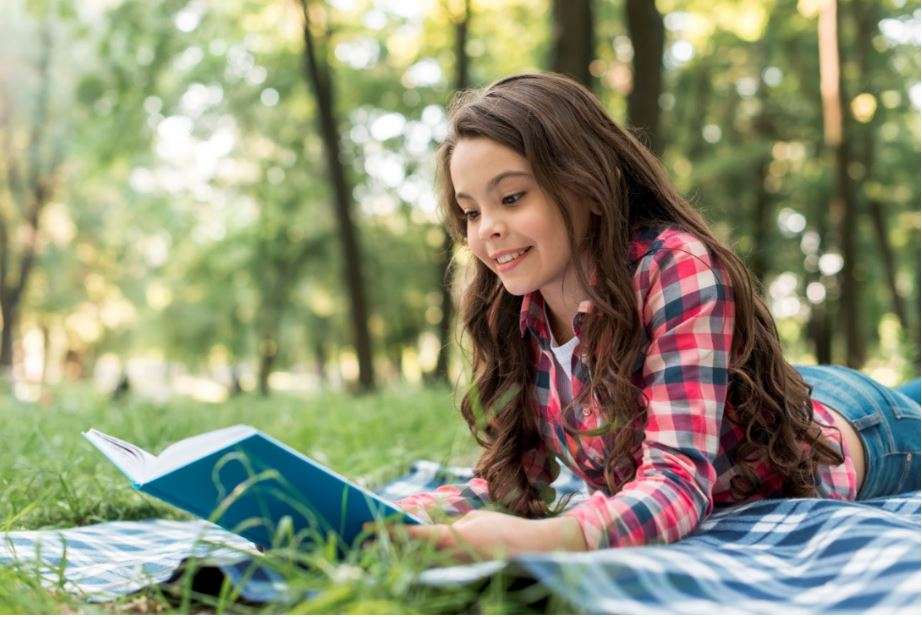 Young girl reading a book 5